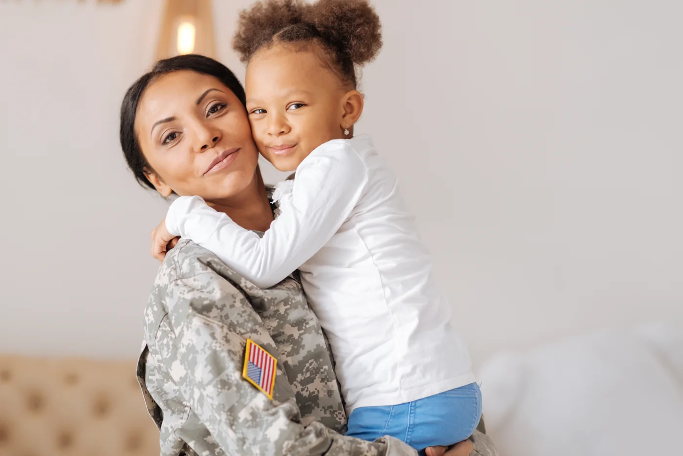 Parent embracing child, representing a military family navigating divorce with Solagree